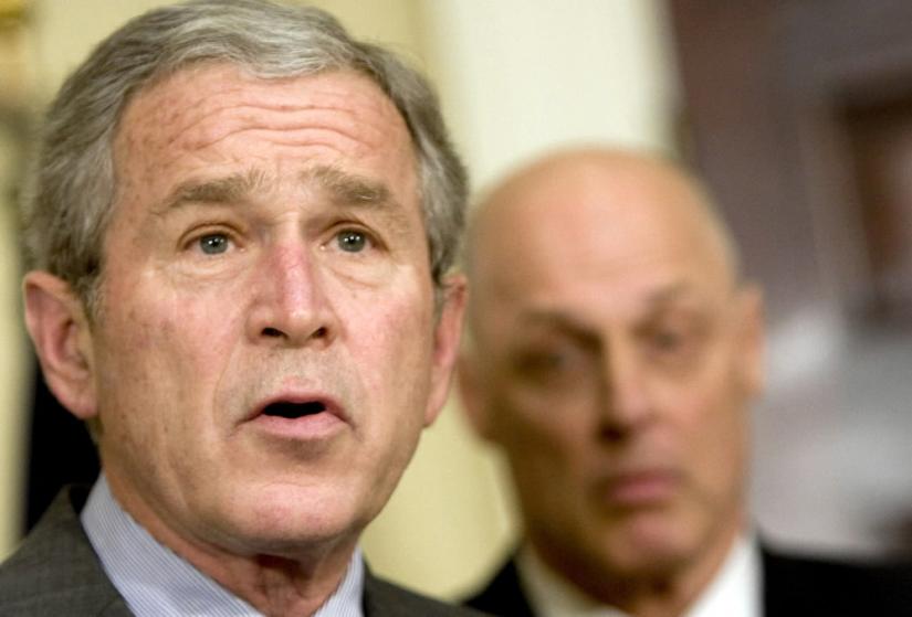 George Bush speaks on the Wall Street bailout as Treasury Secretary Henry Paulson looks on