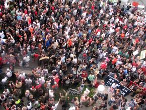 A march of thousands led by members of Iraq Veterans Against the War approaches the Democratic convention site