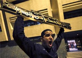 Protesters breaking into the Egyptian State Security building