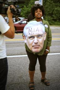 Missouri State Sen. Maria Chapelle-Nadal with a giant cutout head of Democratic Gov. Jay Nixon
